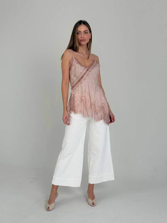 Топ із мереживом та асиметричним низом